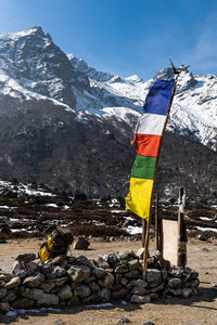 Prayer flag with mountains in background