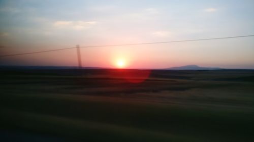 Scenic view of landscape against sky during sunset