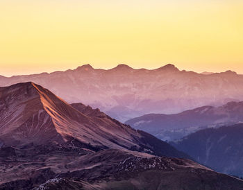 Scenic view of mountains against sky during sunset