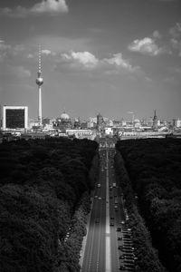 Communications tower against cloudy sky