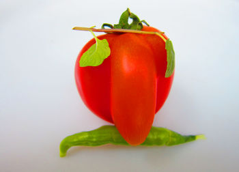 Close-up of tomatoes against white background