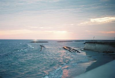 Scenic view of calm sea at sunset