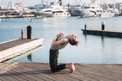 Man on pier over lake