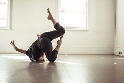 Woman dancing on floor in studio