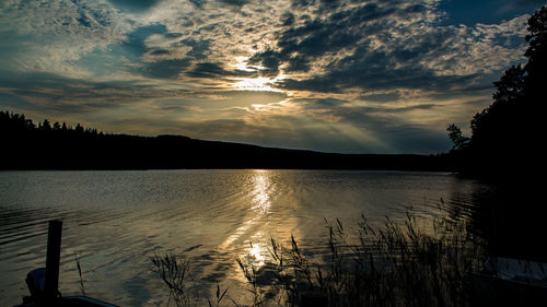 Reflection of clouds in lake at sunset