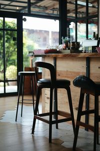 Empty chairs and table in restaurant