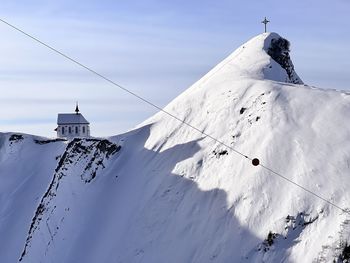 People skiing on snow covered landscape