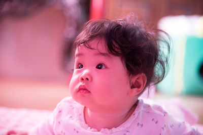 Close-up portrait of cute baby at home