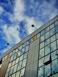 Low angle view of building against cloudy sky