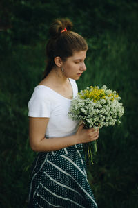 Beautiful woman standing on field