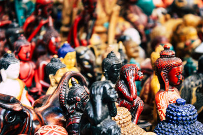 Close-up of figurines for sale in market