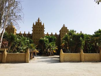 Entrance of crocodile park against sky