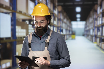 Portrait of engineer working in factory