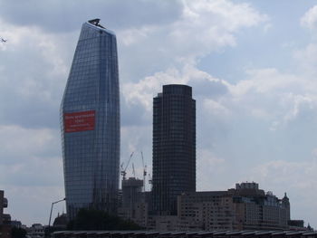 Low angle view of modern buildings against sky in city