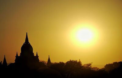 Silhouette of temple against sky during sunset