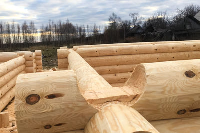 Close-up of wooden structure against sky