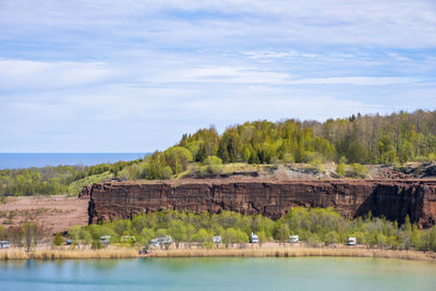 Motorhomes in a disused quarry with a lake