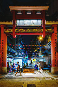 People in illuminated building