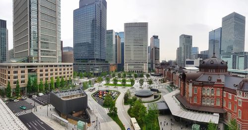 High angle view of modern buildings in city against sky