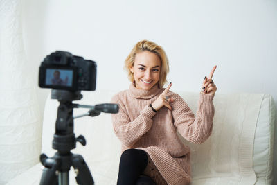 Young woman blogger use camera to record video for social vlog. 