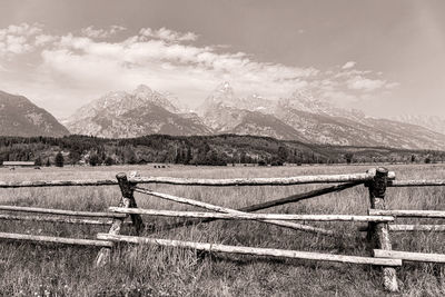 Fence on field against sky