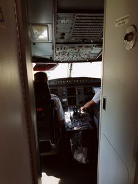 Rear view of people on airplane window