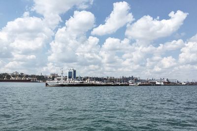 Scenic view of sea and buildings against sky