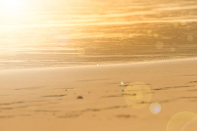 Scenic view of beach against sky during sunset