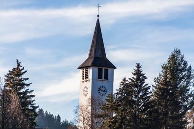 Low angle view of church against sky during winter