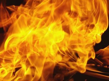 Close-up of yellow fire at night