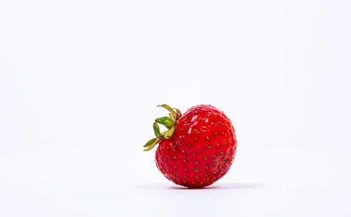 Close-up of strawberry against white background