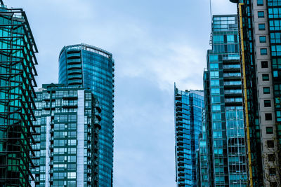 Low angle view of modern buildings against sky