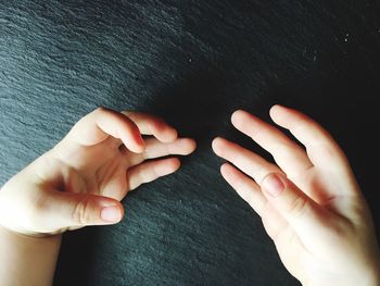 Close-up of hands holding baby hand