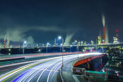 High angle view of light trails on road at night