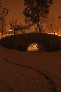 View of snow covered land at night