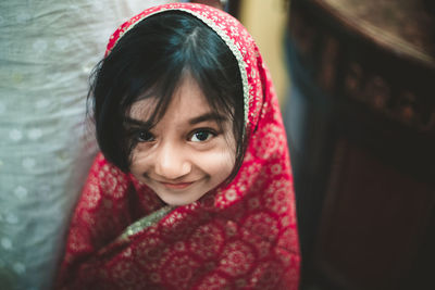 Close-up portrait of smiling girl in sari