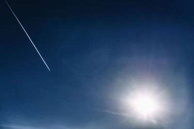 Low angle view of vapor trails in sky