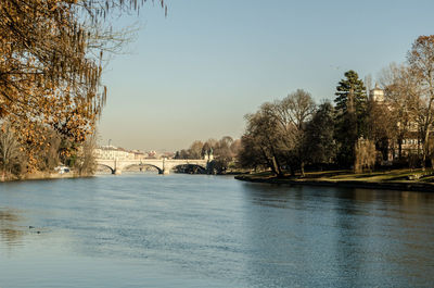 Bridge over river against clear sky