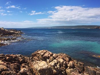 Scenic view of sea against cloudy sky