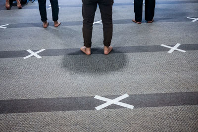 Low section of people standing on floor