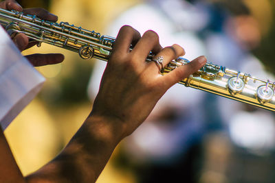 Close-up of man playing guitar