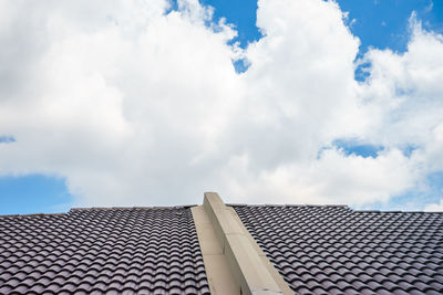 Low angle view of telephone pole against sky