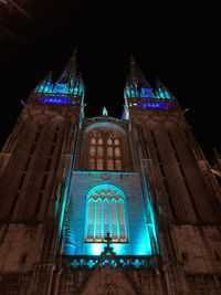 Low angle view of illuminated building at night