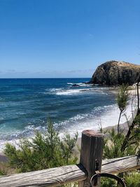 Scenic view of sea against clear blue sky