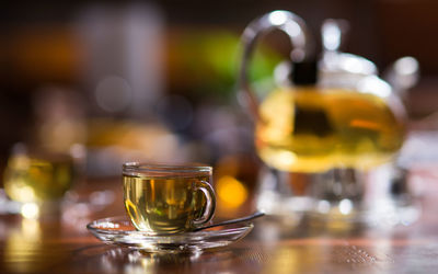 Close-up green tea in cup on table at home