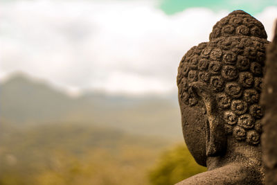 Close-up of statue against sky