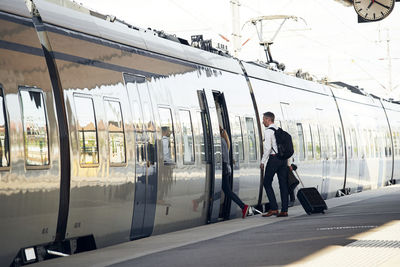 Man entering train at train station