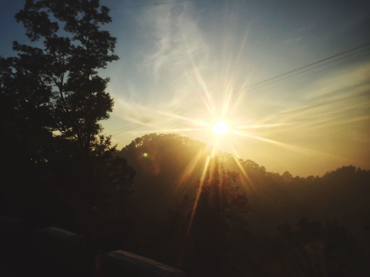 sun, sunbeam, silhouette, sky, tree, sunlight, sunset, tranquility, lens flare, tranquil scene, beauty in nature, scenics, nature, cloud - sky, low angle view, idyllic, landscape, outdoors, no people, cloud