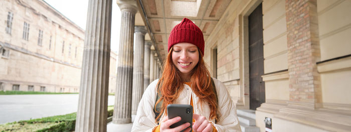 Young woman using mobile phone