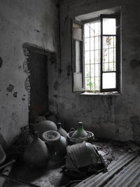 Damaged window in abandoned building